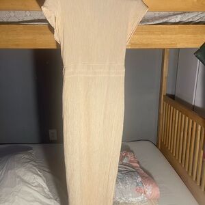 Cream colored very fine small pleats and button down